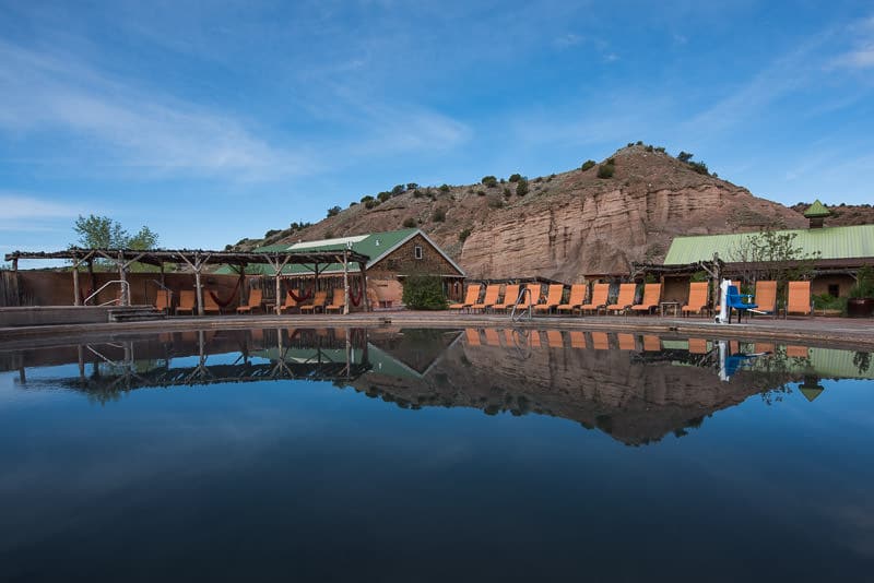 the-entrance-to-ojo-caliente-hot-springs-in-new-mexico-is-marked-by-a