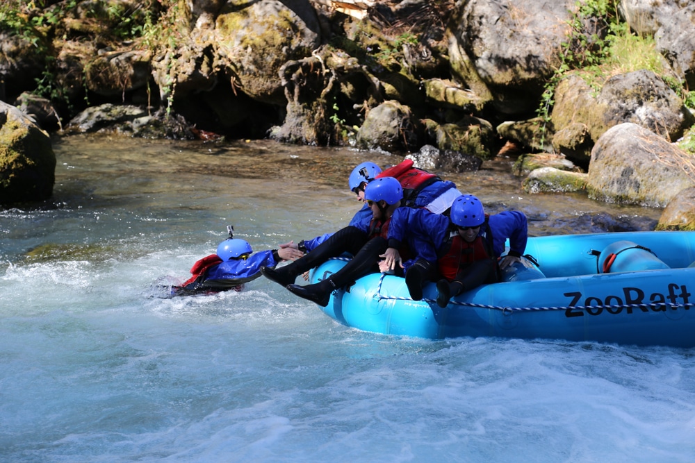 Helping pull Brooke back into the raft after she fell out 'Riding the Bull' on the White Salmon River.