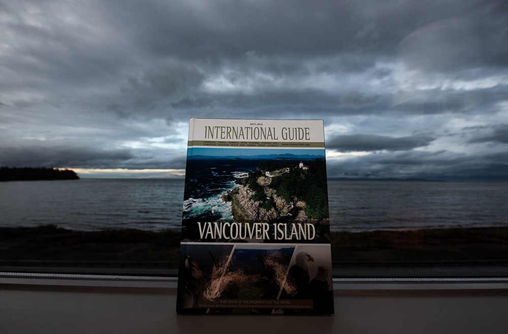 Vancouver Island guide book set against the window of the view from our room at the beach club resort parksville bc