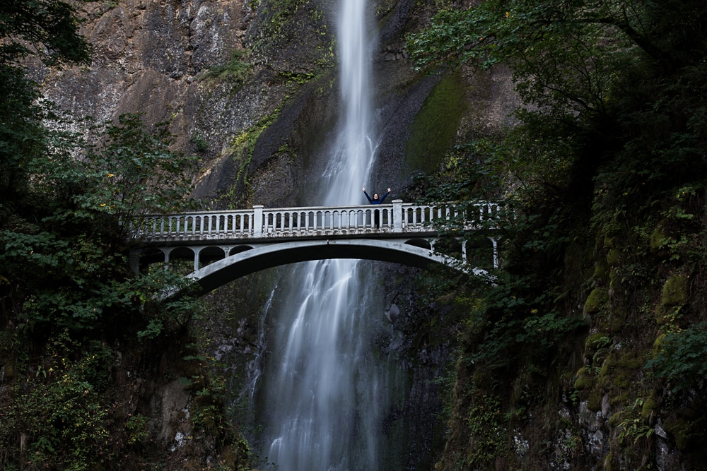 Brooke standing atop Benson Bridge at Multnomah Falls in Oregon