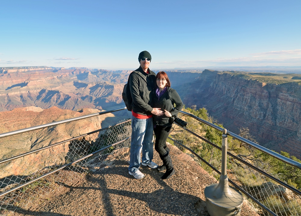 Brooke and Buddy posing for a photo at one of the viewpoints for the Grand Canyon