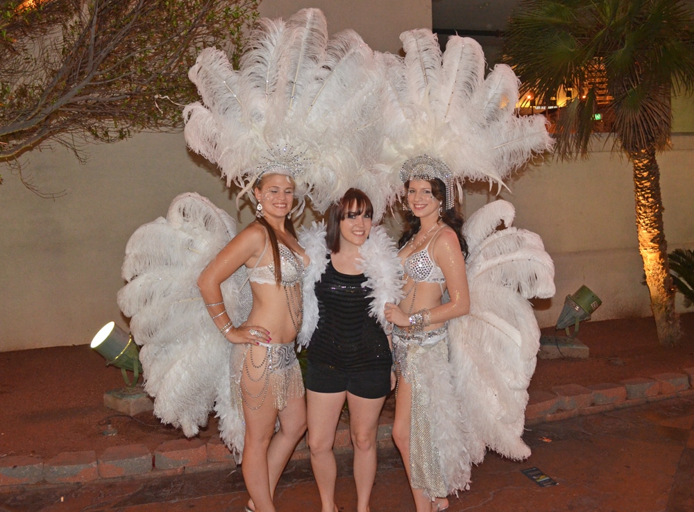 Brooke posing for a photo with some of the Las Vegas Dancers and streel performers