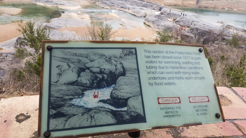 Sign warning of the dangers of the swift water and undertows created at Pedernales Falls State Park