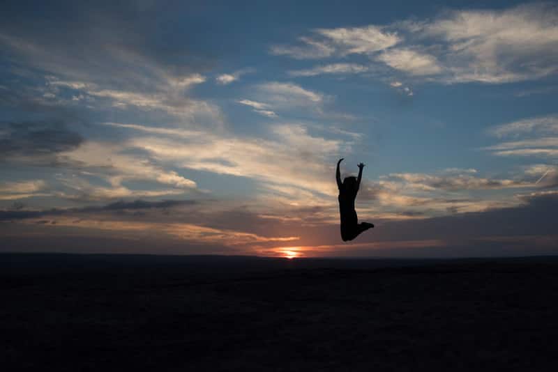 Brooke Jumping for Joy in the sunset that she has found a community of like minded people