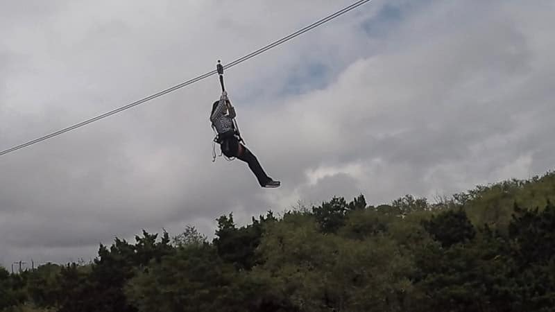 Brooke stuck in the air during her zip-line at Natural Bridge Caverns in Texas