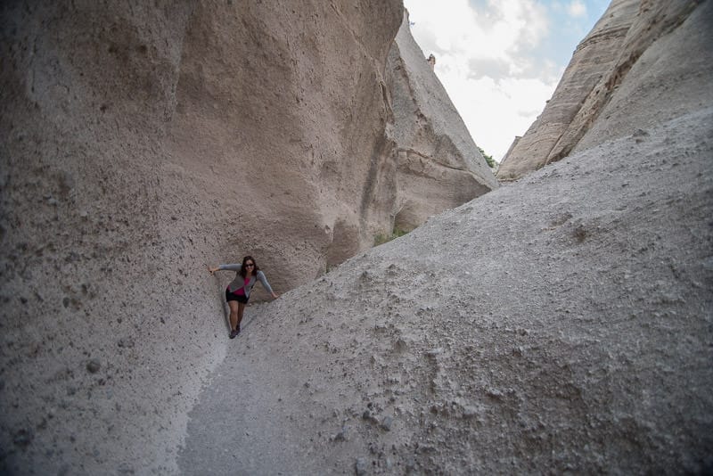 Brooke hiking through a slow canyon at Kasha-Katuwe Tent Rocks National Monument