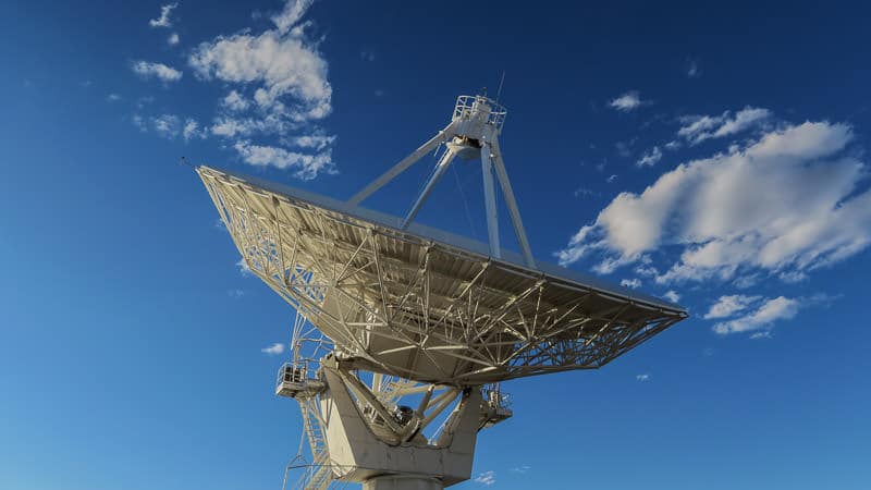 Satellite of the VLA pointed towards the blue clouded sky