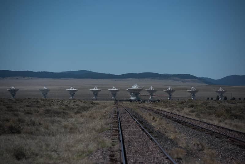 Some of the tracks of the very large array with mountains in the background