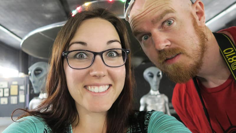 Brooke and Buddy posing with the alien exhibit at the roswell UFO Museum