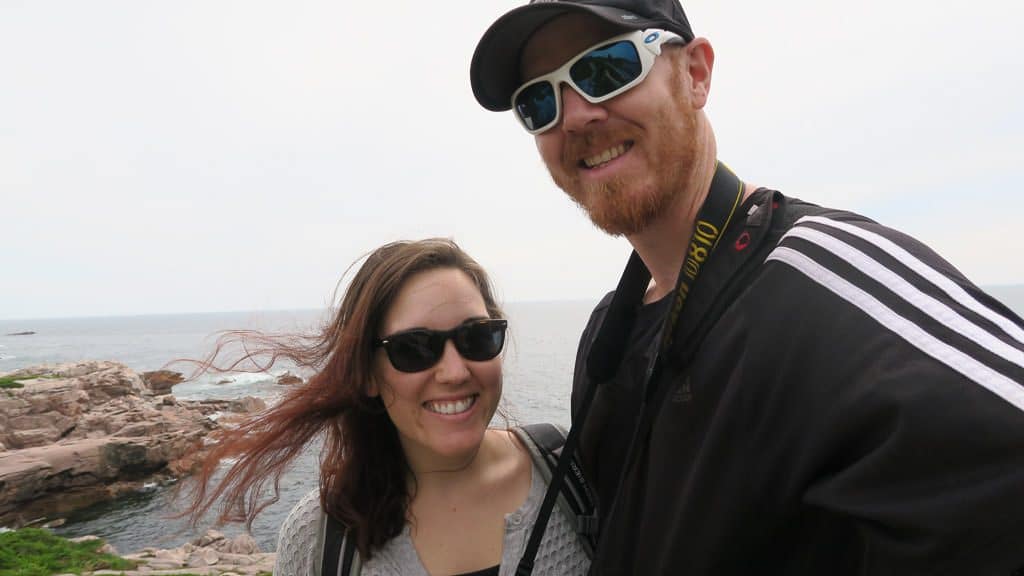 Brooke and Buddy taking a selfie on the cliff of their hike in Cape Breton Highlands