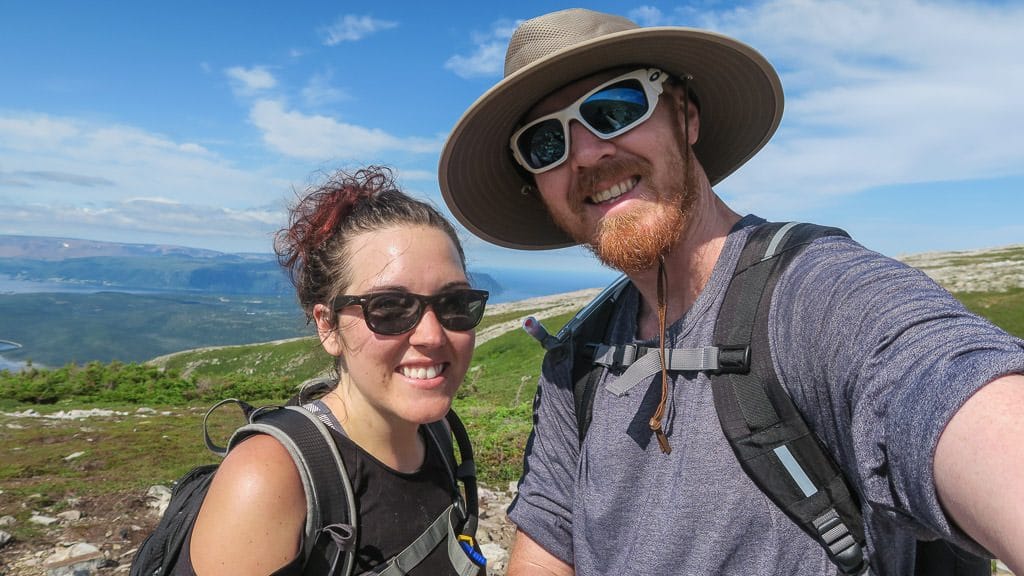 Brooke and Buddy taking a photo after reaching the top of the rock gully