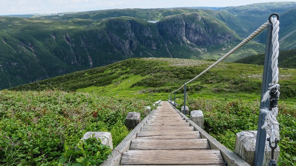 Set of stairs and rope handle leading down Gros Morne Mountain