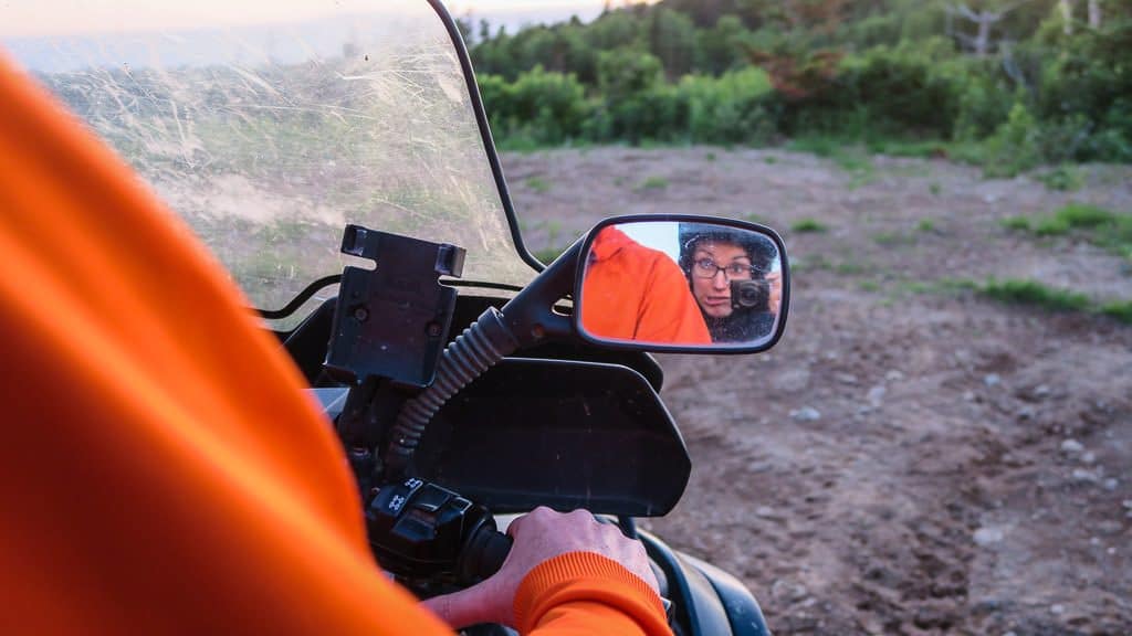 Brooke taking a photo in the side mirror during our ATV tour