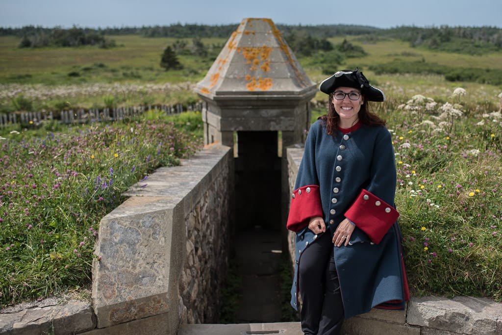 Brooke posing for a photo op on the side of the wall at Fortress of Louisbourg