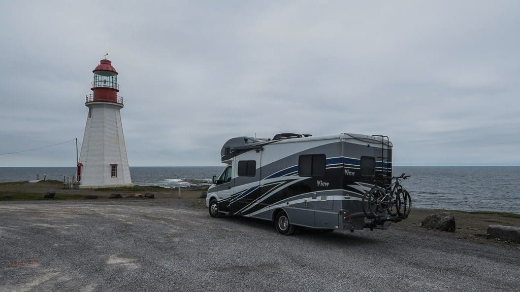 Winnebago View parked next to the lighthouse in Newfoundland
