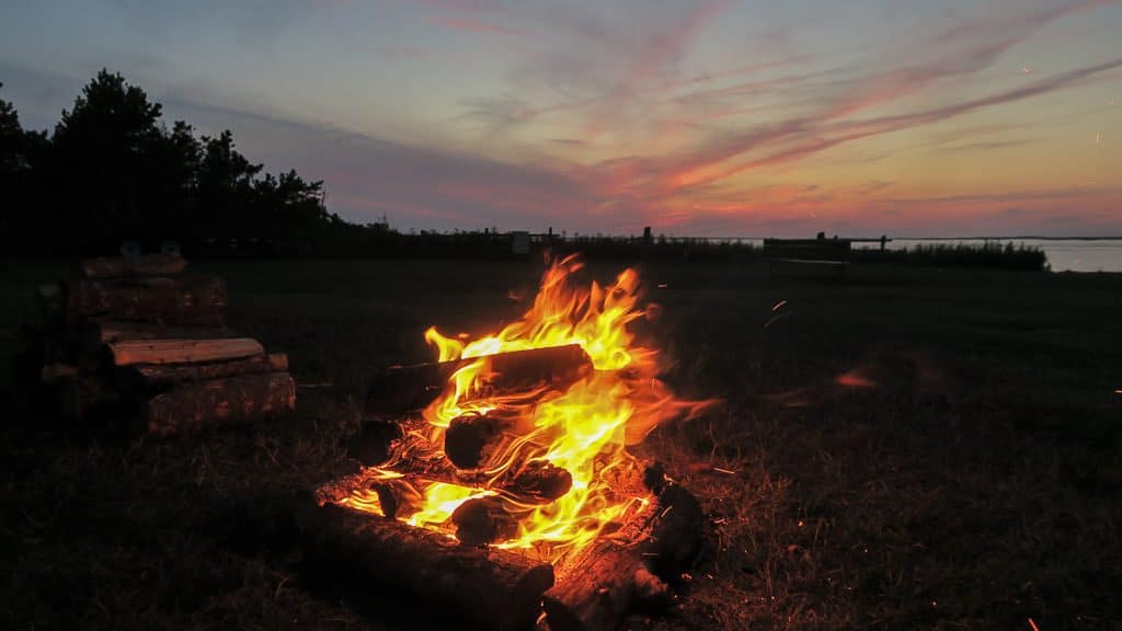 Campfire at our RV site in Cabot Beach Campground during sunset
