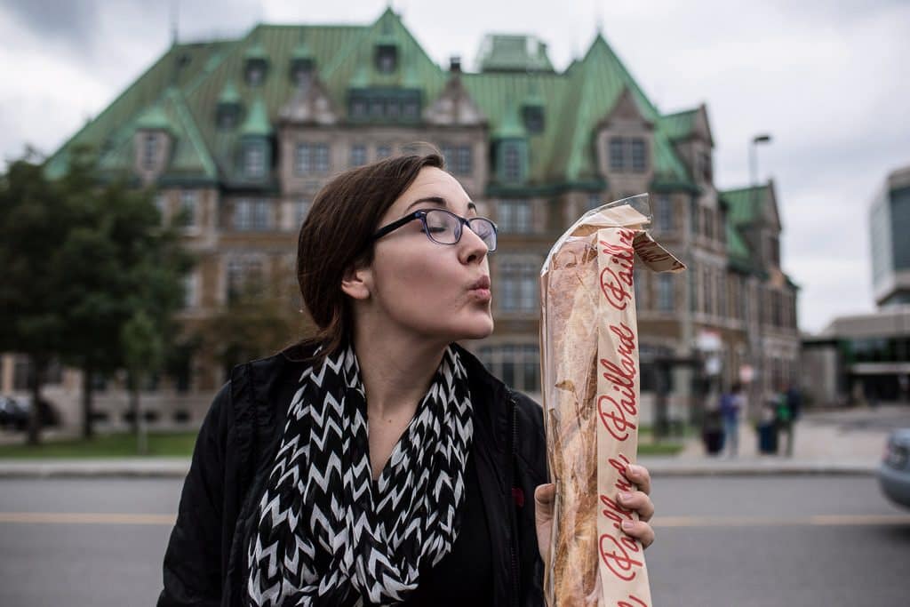 Brooke pretending to kiss the giant baguette that we got on the way back to our RV.