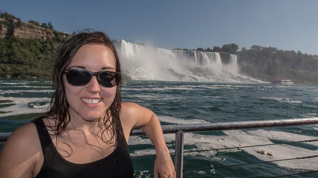 Brooke soaking wet posing on our Hornblower Niagara Cruise boat with Niagara Falls in the background