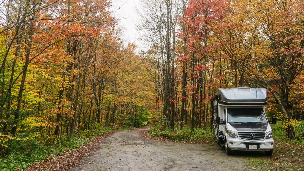 Our Winnebago View sitting off the dirt road on a nice colorful drive through Green Mountains while chasing fall in vermont