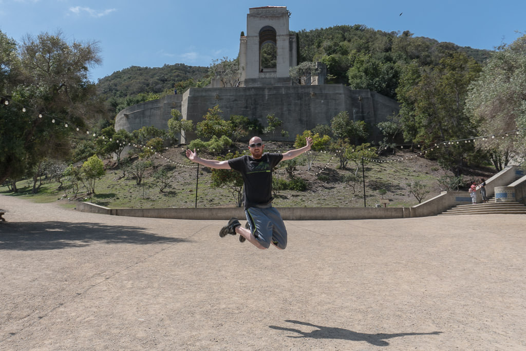 Buddy jumping in the air in front of the Wrigley Memorial in Catalina Island