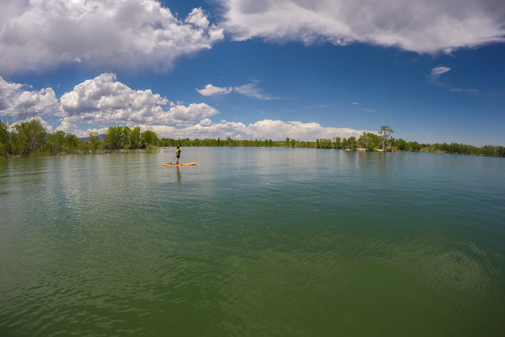 Brooke paddleboarding on the flat waters of standley lake