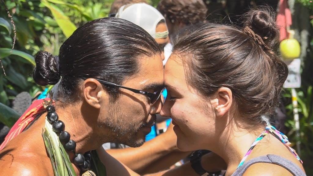 traditional hawaiian greeting with foreheads pressed against each other