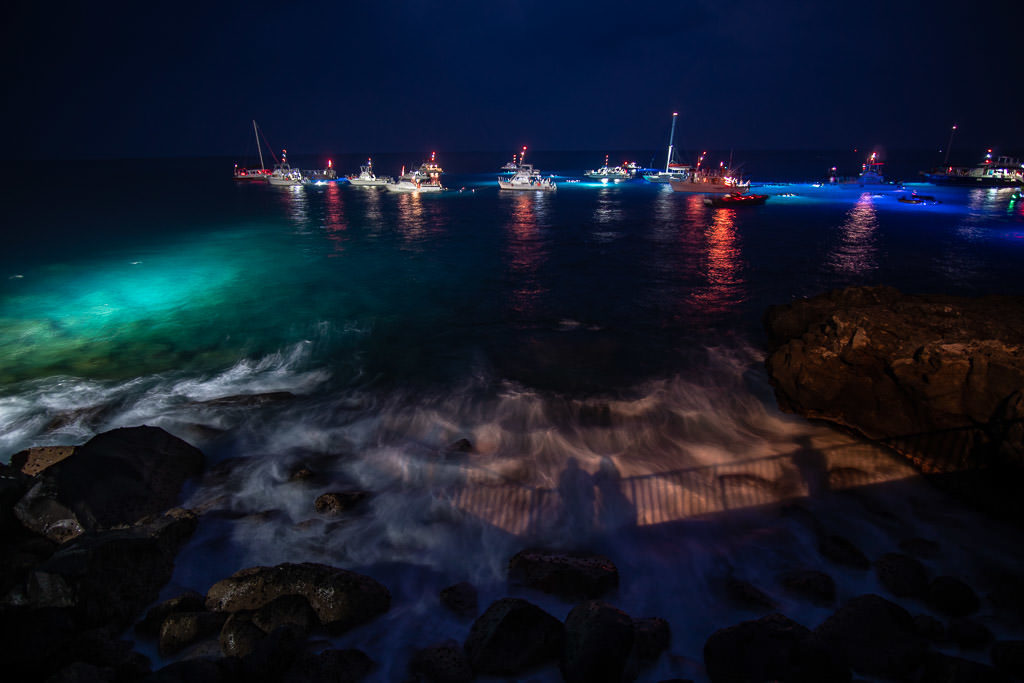 Numerous boats and tours out in the Manta Ray location in Kona on the Big Island of Hawaii, a view from Ray's on the Bay