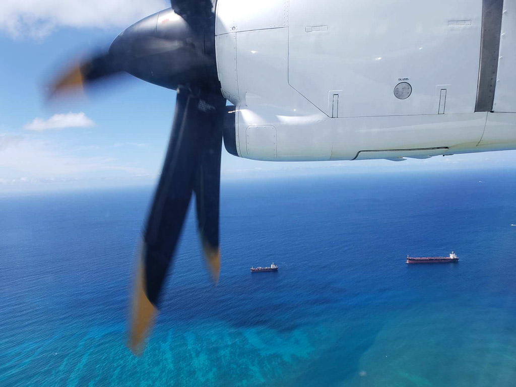 plane propeller over the ocean on the way to lanai