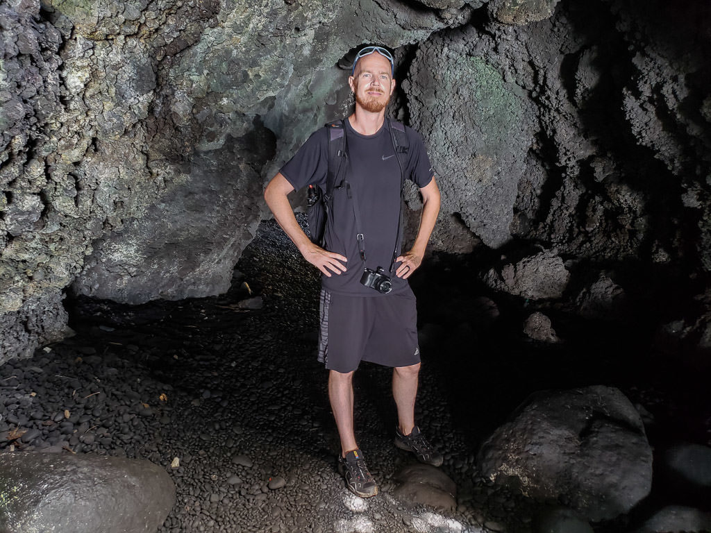 Buddy inside the Volcanic Sea Cave at the black sand beach in Wai'anapanapa State Park