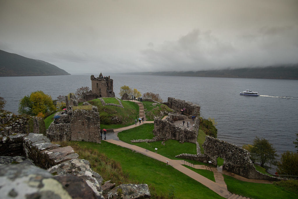 Urquhart Castle with loch ness in the background on a cloudy day in inverness