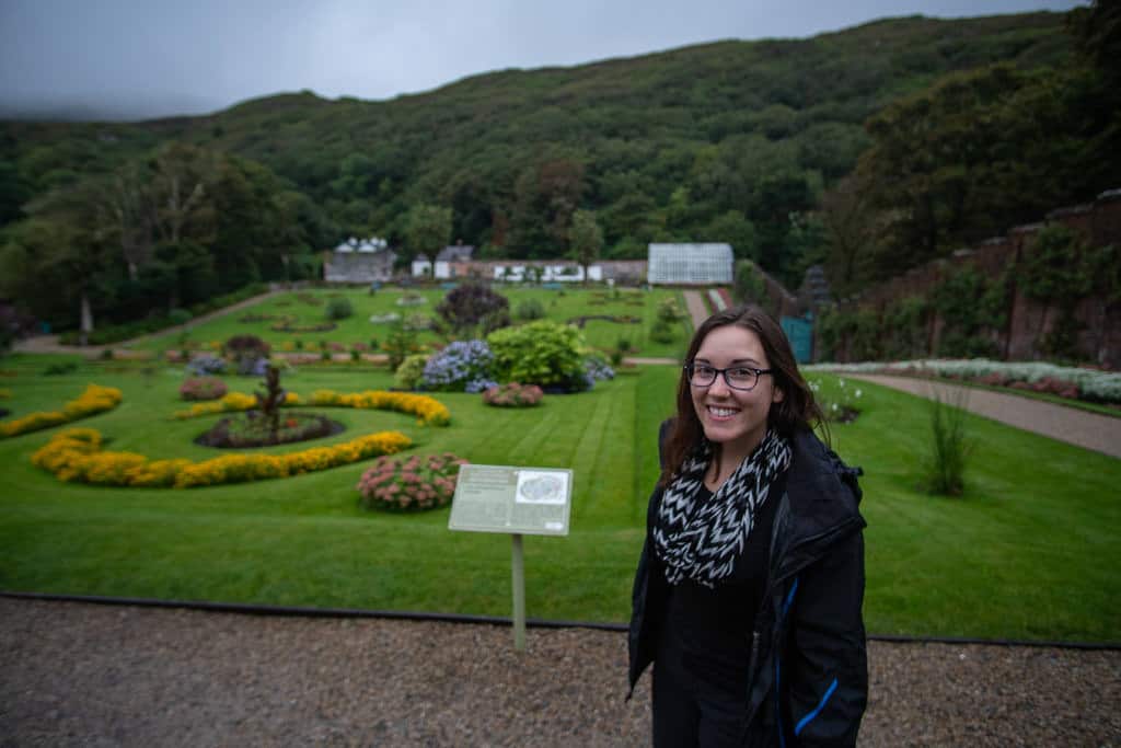 Brooke with the beautiful Victorian walled garden behind her at Kylemore Abbey