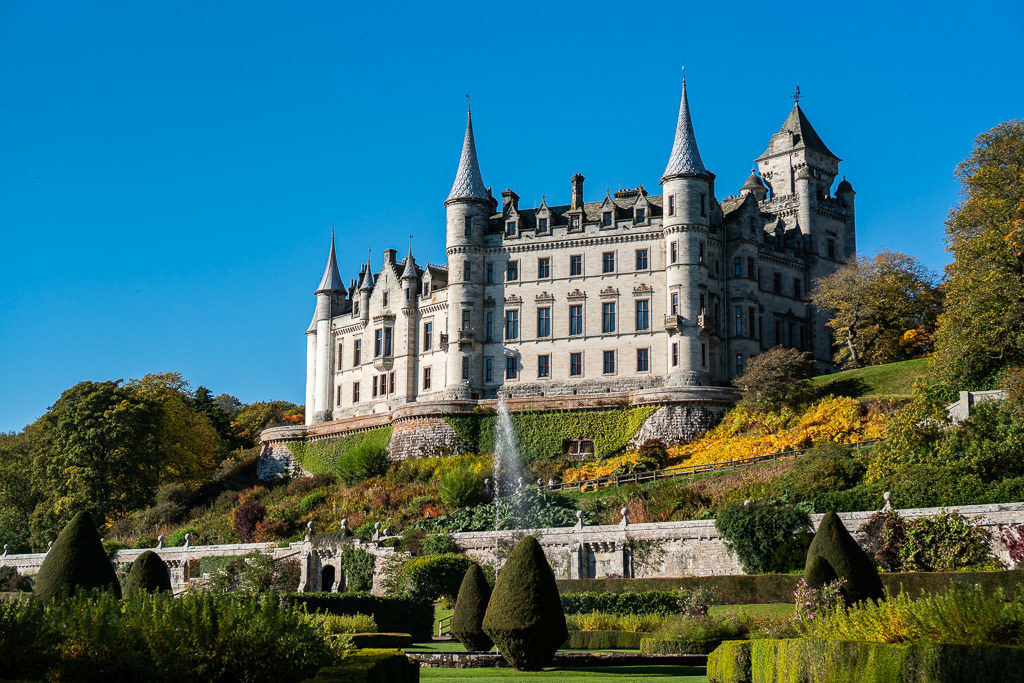 The beautiful French-inspired Dunrobin Castle from the garden set behind the castle entrance. This is a perfect day trip from Inverness Scotland