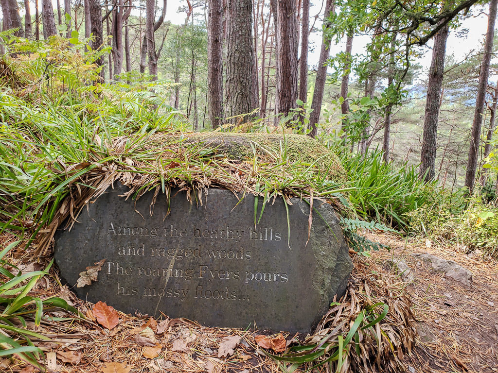 Rock with a verse carved into it on the trail to Falls of Foyers