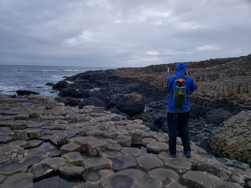 Buddy taking some photos and enjoying the coastal views while at the Giant's Causeway