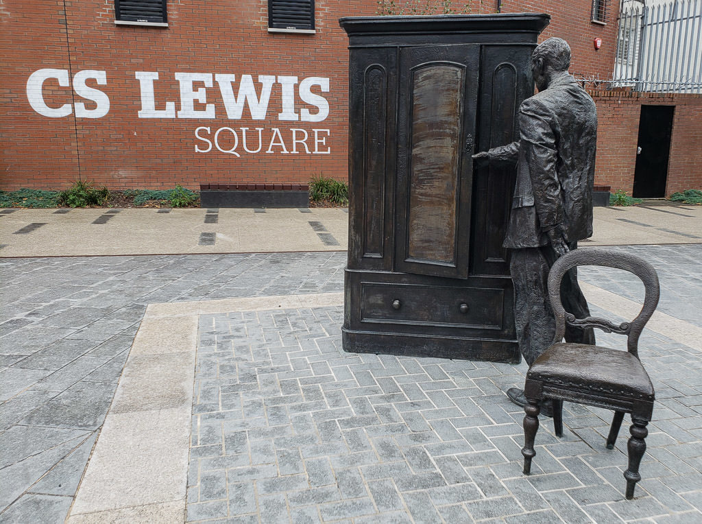 Statue of C.S. Lewis looking into the wardrobe in CS Lewis Square in Belfast, Northern Ireland