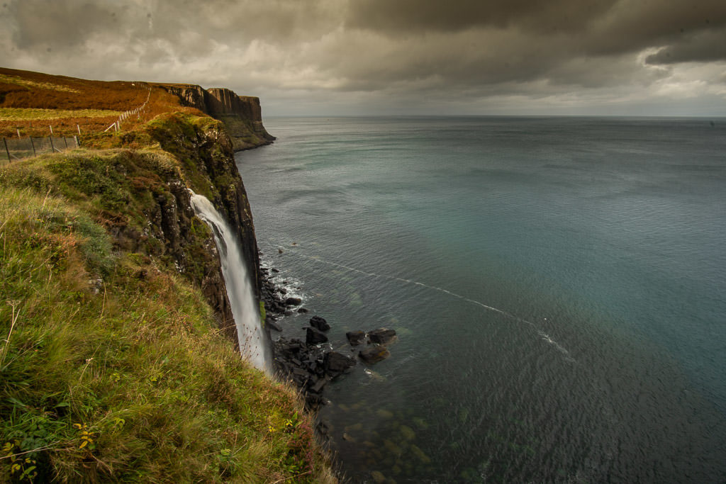 The gorgeous Mealt Falls going over the cliff in the Isle of Skye on a cloudy and gloomy day