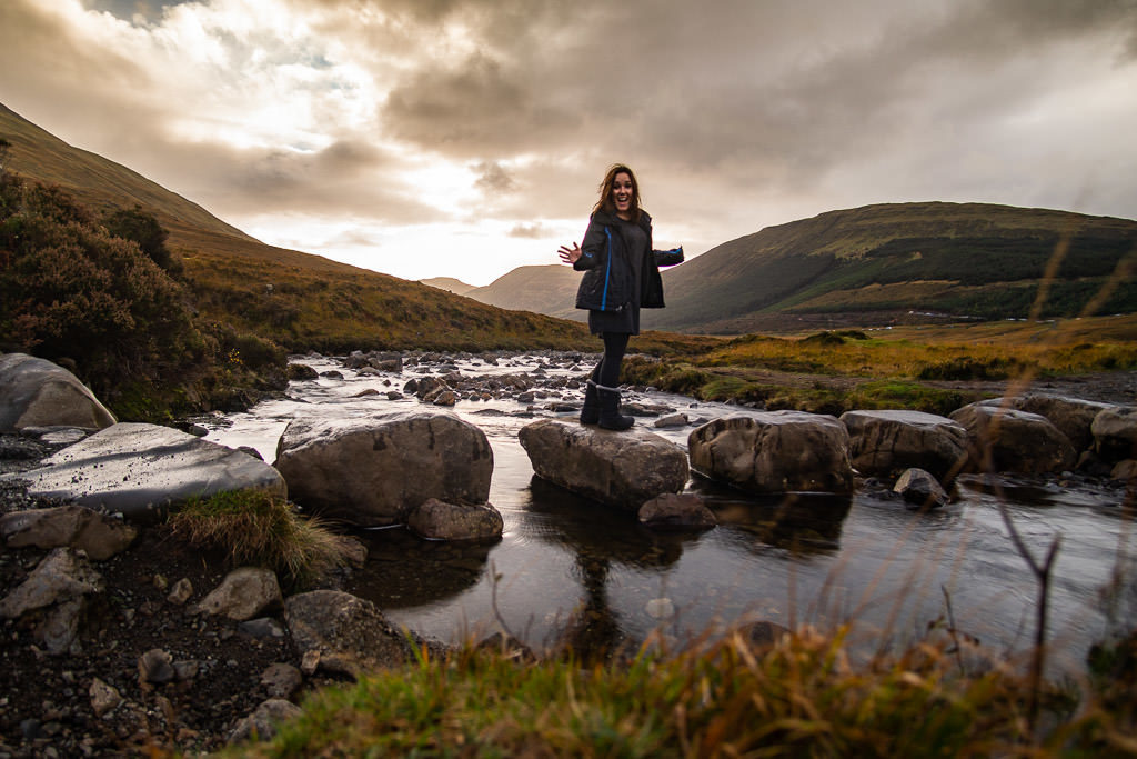Brooke standing on some rocks at the Fairy Pools where we needed to cross over a river