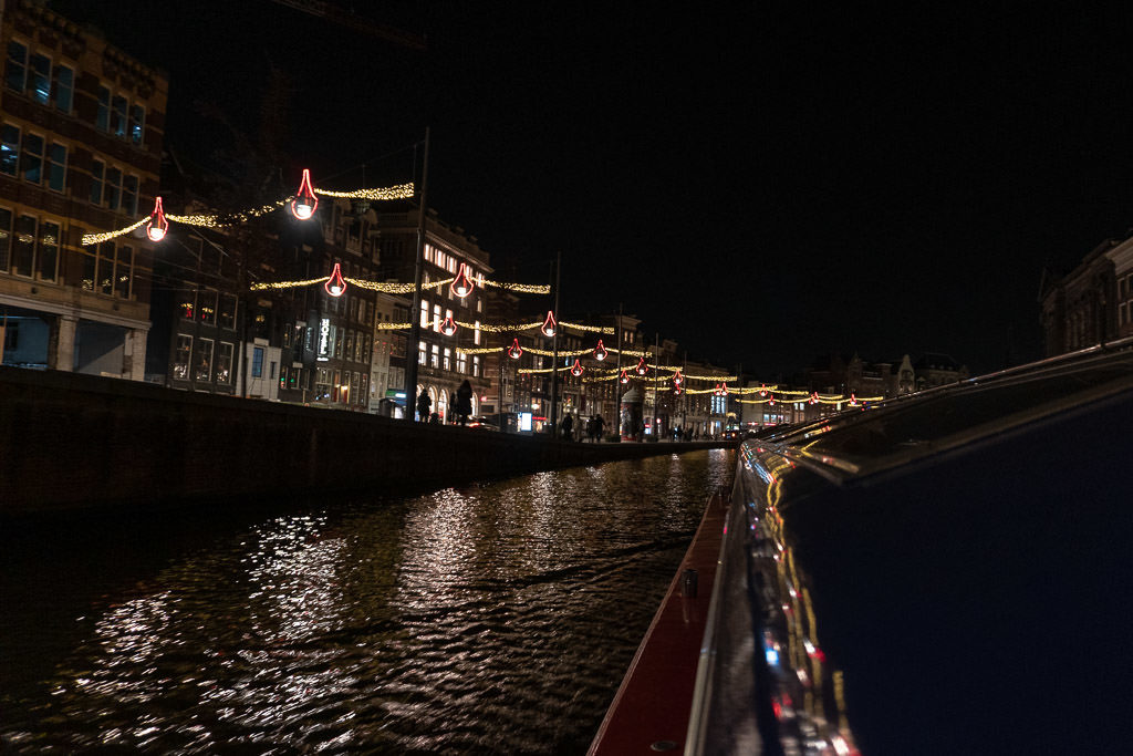 amsterdam canal boat tour lit up at night