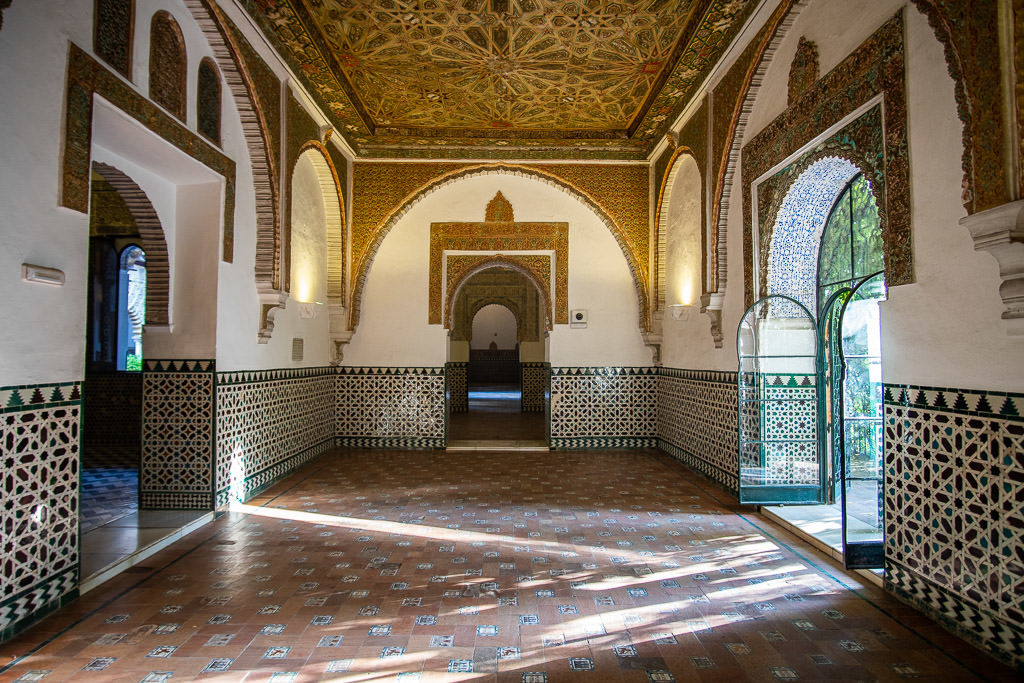 ornate room with tile in the real alcazar in sevilla spain