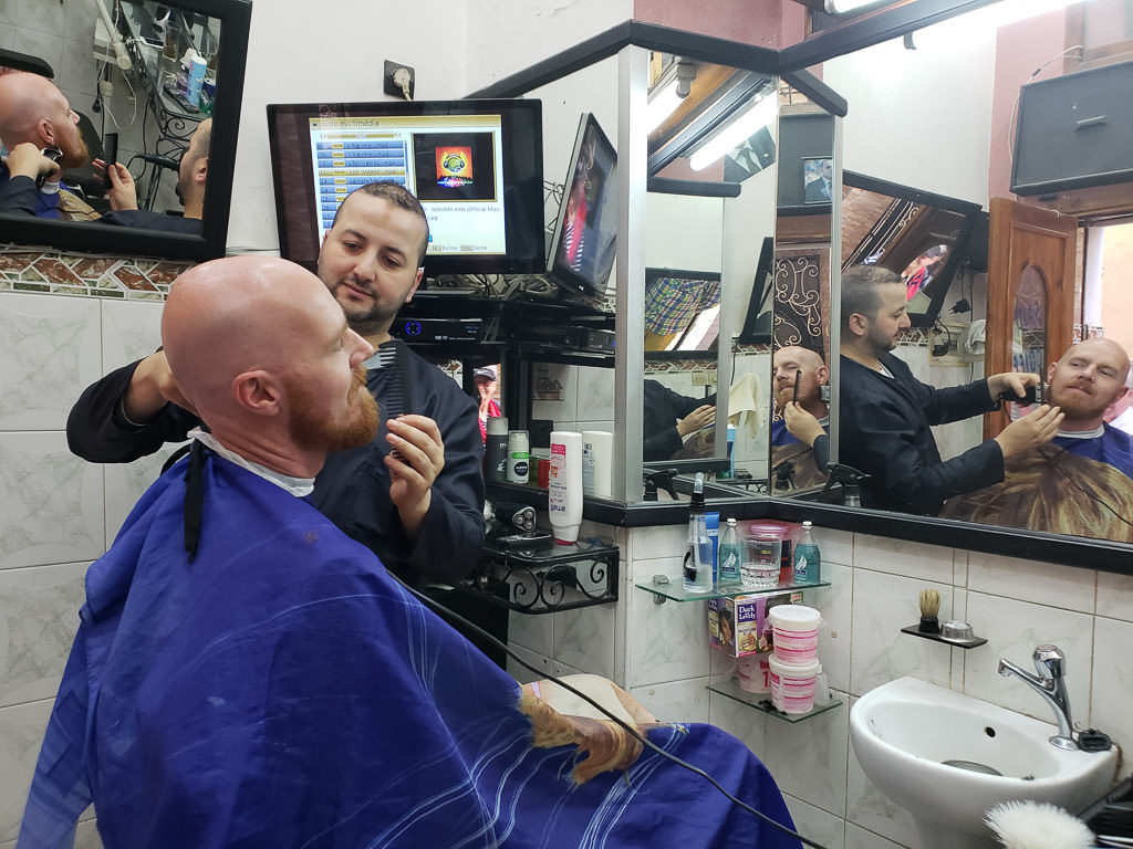 getting a cheap shave in tangier on day trip to Morocco tour