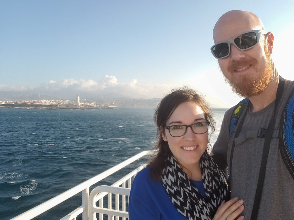 selfie with tangier behind on ferry for day trip to Morocco