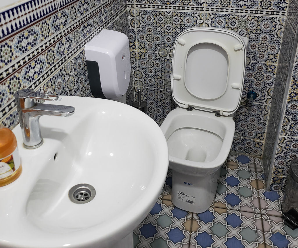 clean western-style bathroom at restaurant in tangier on day trip to Morocco tour