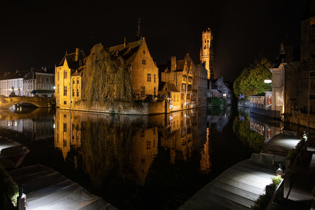 iconic buildings on canal in bruges belgium at night
