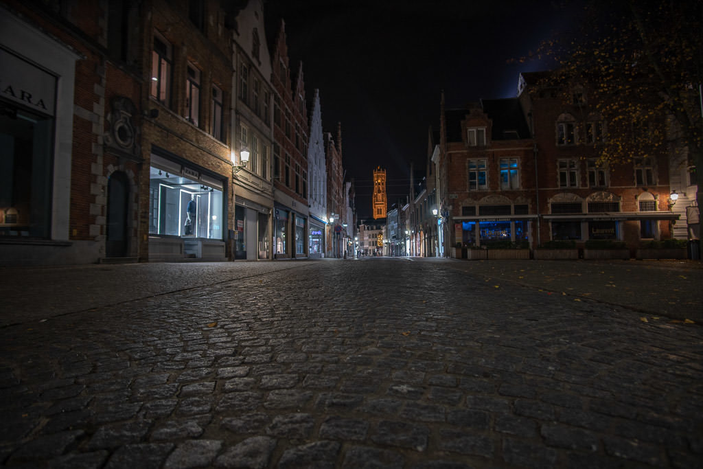 sidewalk and city at night during a perfect weekend in bruges belgium 