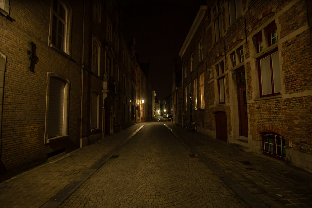 side street in bruges belgium at night