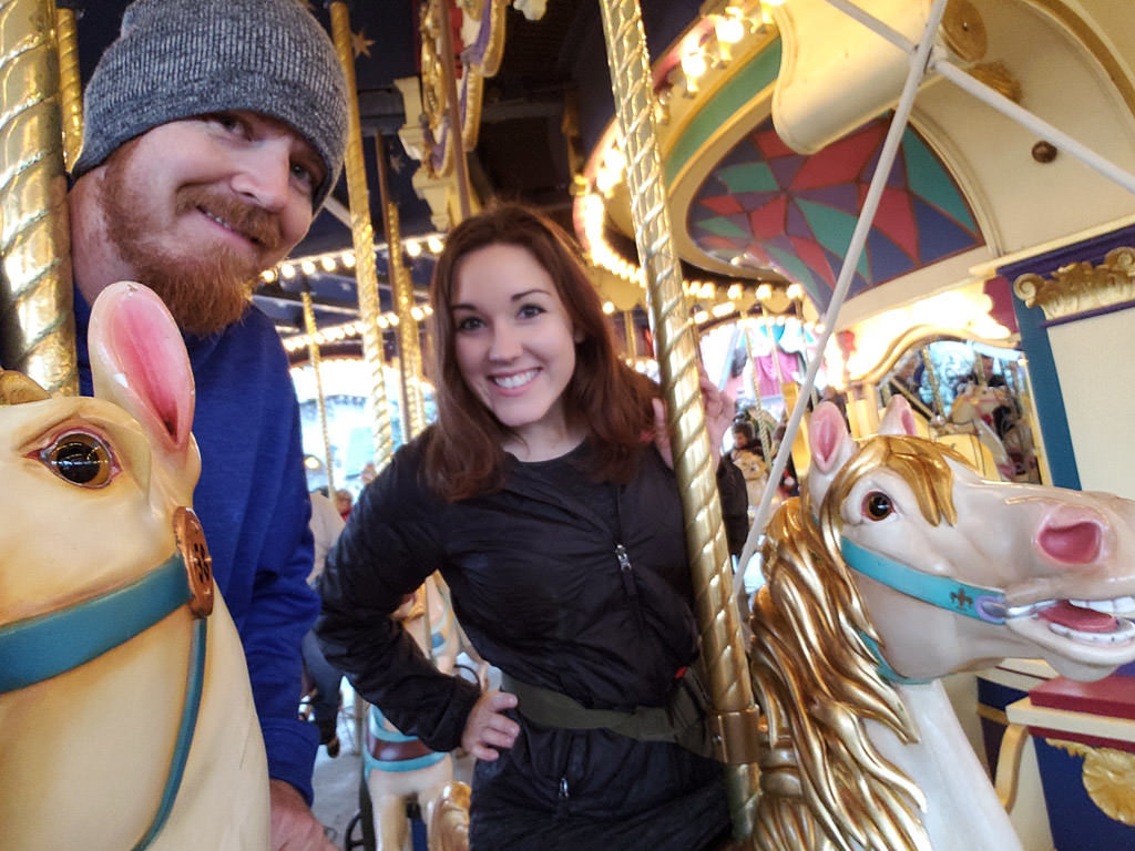 couple on carousel at disneyland paris