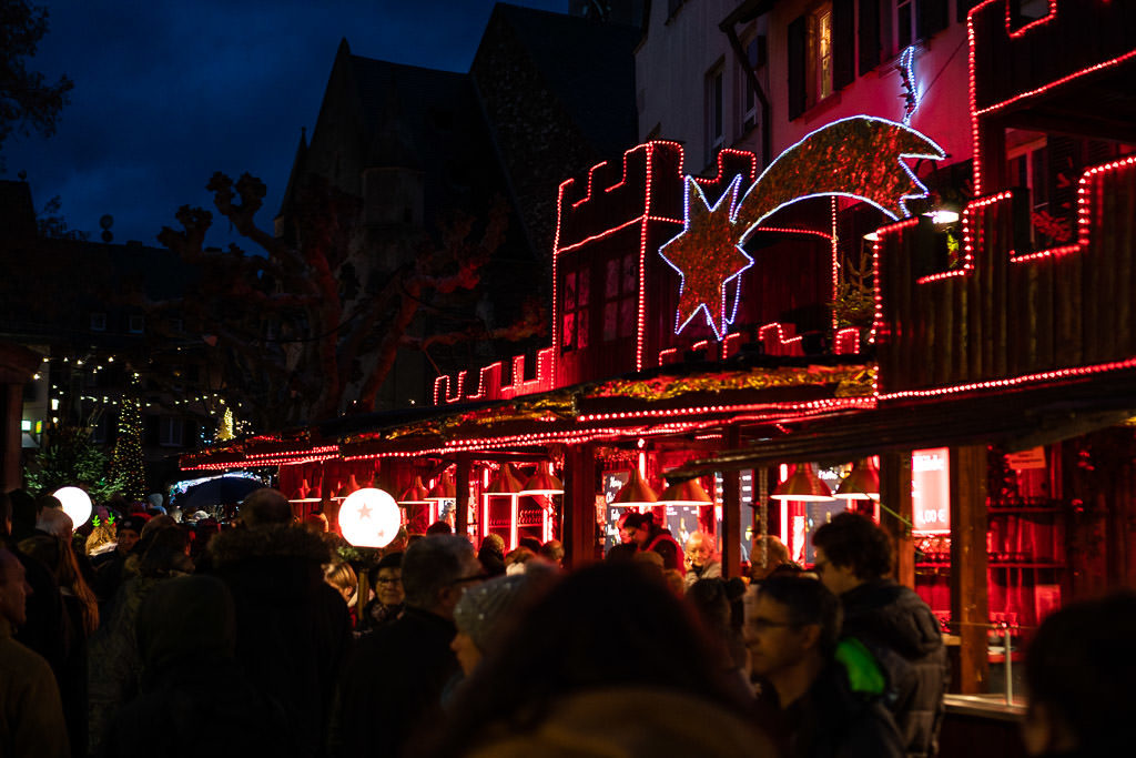 lighted street at rhine river christmas market in germany