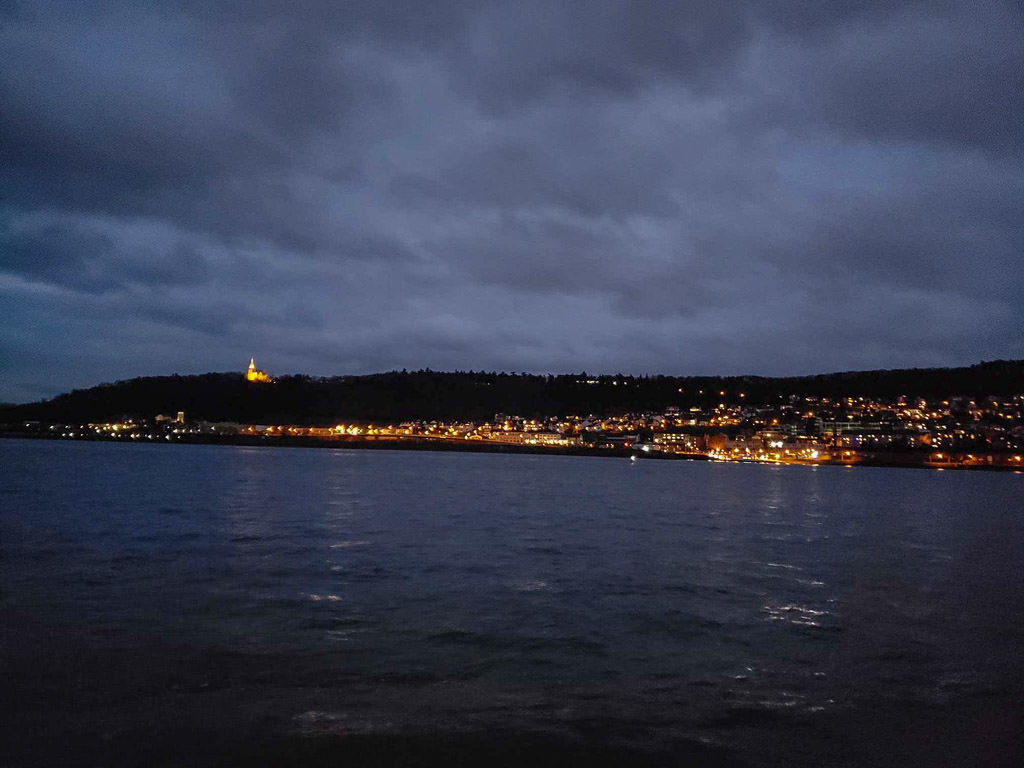 rhine river town lit up at night