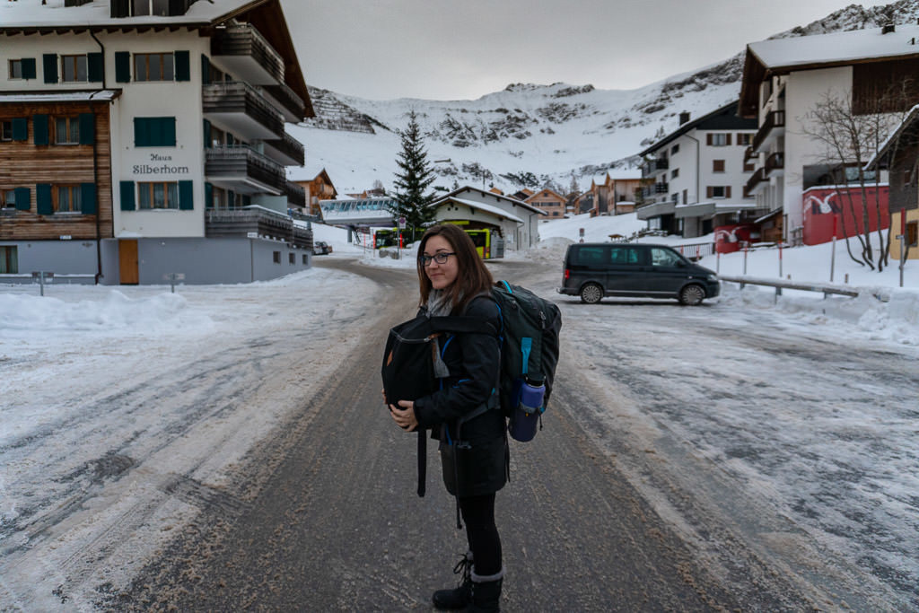 holding carry-on bags in malbun Liechtenstein in winter