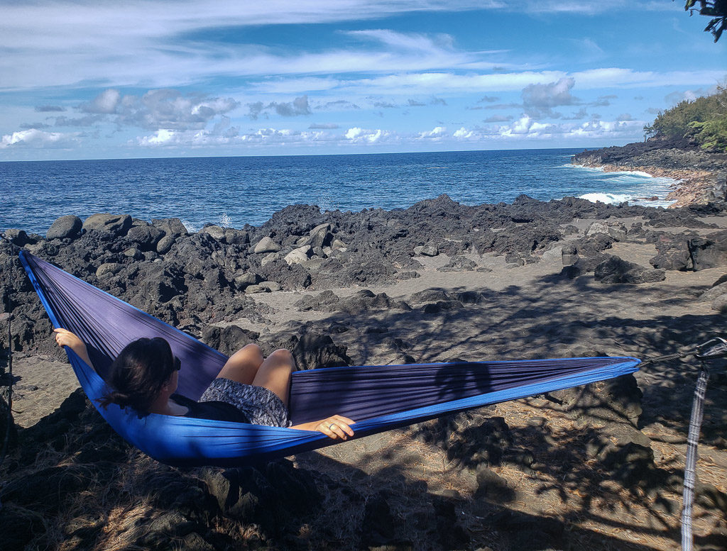 embracing island life while in a hammock in hawaii during a house sitting gig